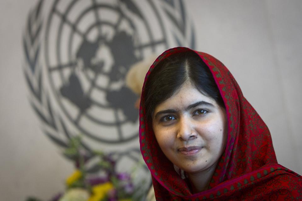 Pakistani schoolgirl activist Malala Yousafzai poses for pictures during a photo opportunity at the United Nations in New York, in this file photo taken August 18, 2014. Yousafzai was named to Time's annual unranked list of most influential teenagers, the magazine said on Monday. REUTERS/Carlo Allegri/Files (UNITED STATES - Tags: SOCIETY POLITICS)