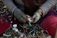 The Wider Image: Cash for trash: Indonesia village banks on waste recycling