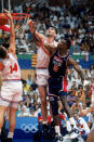 BARCELONA, SPAIN - JULY 27: David Robinson #5 of the United States goes up for a rebound against Stojan Vrankovic #11 and Dino Radja #14 of Croatia during the 1992 Olympic game against Croatia on July 27, 1992 in Barcelona, Spain. The "Dream Team" defeated Croatia 103-70.