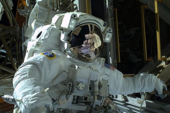 NASA astronaut Mike Hopkins looks to the camera during his first spacewalk on Dec. 21, 2013.