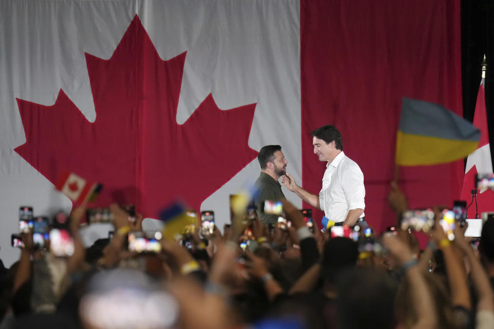 Canadian Prime Minister Justin Trudeau, right, introduces Ukrainian President Volodymyr Zelenskyy at a rally at the Fort York Armoury in Toronto, on Friday, Sept. 22, 2023. (Nathan Denette/The Canadian Press via AP)