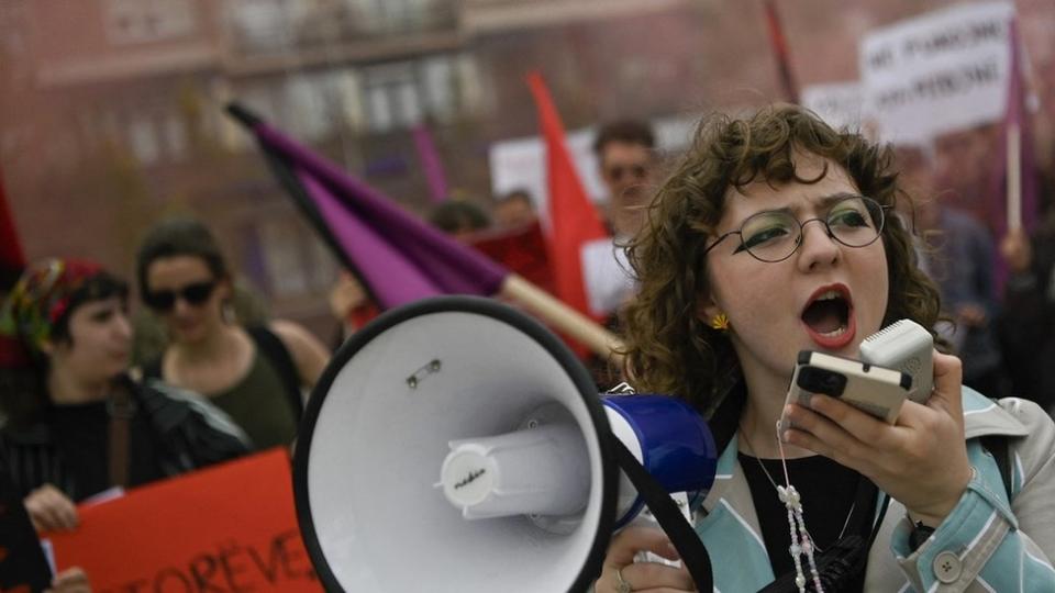 A protester shouts slogans during a May Day rally marking International Workers' Day in Pristina, Kosovo.