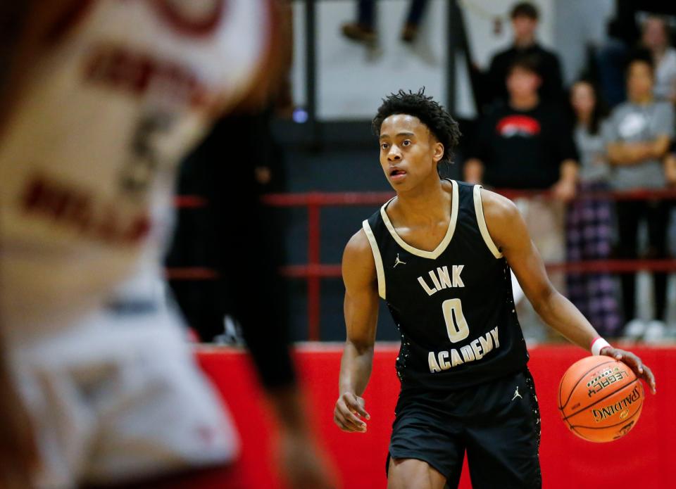 Texas basketball signee Tre Johnson moves the ball downcourt for Link Academy in Missouri in a game this past season. Johnson scored 17 points n Tuesday's McDonald's All-American Game in Houston.