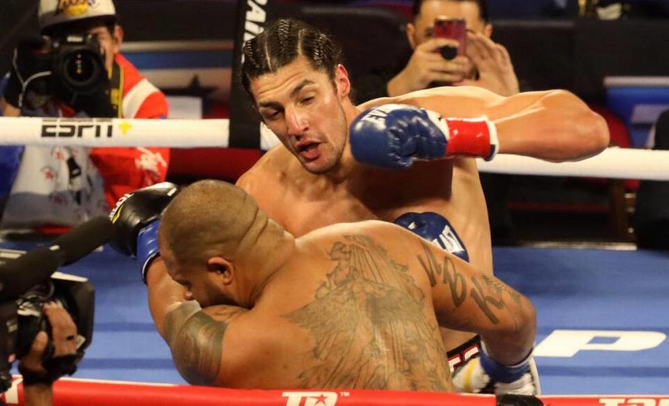 Anthony ‘El Gigante’ Mireles of Iowa lands a left punch against Brandon Hughes of Alabama in a heavyweight bout at the Save Mart Center on March 4, 2022.