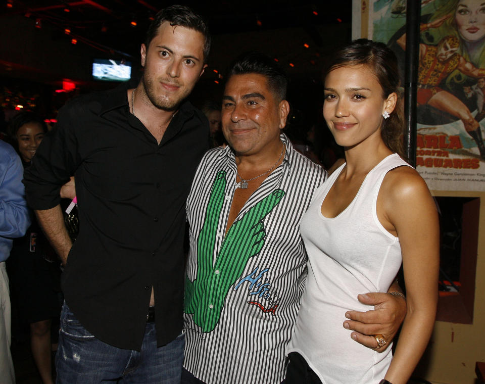 FILE - In this June 28, 2007 file photo, Harry Morton, left, Luis Barajas, center, founder of Flaunt magazine, and Jessica Alba are seen at the opening of the Pink Taco restaurant in Los Angeles. Harry Morton, a restaurant mogul who is the son of the Hard Rock Cafe chain co-founder and grandson of the Morton's The Steakhouse founder, has died. Pink Taco, a restaurant business Morton founded and previously owned, confirmed his death in a statement Sunday, Nov. 24, 2019. He was 38. (AP Photo/Chris Polk, File)