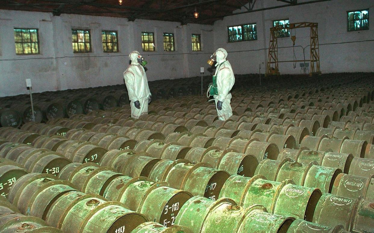 Russian soldiers check a chemical weapons storage site in Gorny, Russia, 2000 - AP