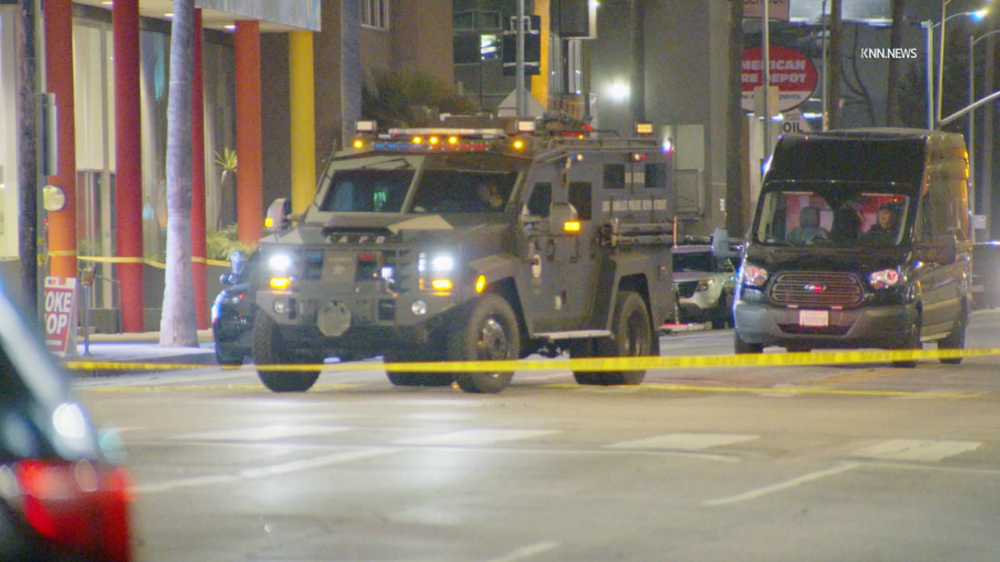 Armored LAPD vehicles respond to a barricade situation in Hollywood