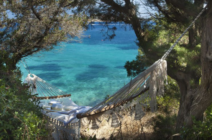 A hammock overlooking the sea at <a href="http://www.hotelcapodorso.com/" rel="nofollow noopener" target="_blank" data-ylk="slk:Hotel Capo D’Orso;elm:context_link;itc:0;sec:content-canvas" class="link ">Hotel Capo D’Orso </a>