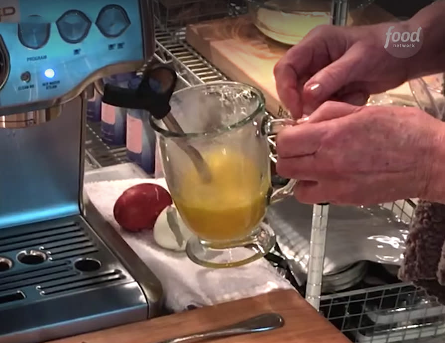 She then inserts the steam wand from a coffee machine straight into the eggs. Photo: Facebook/Food Network