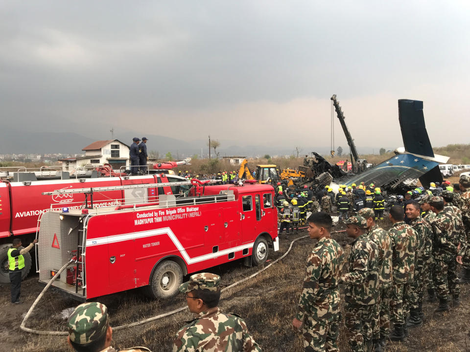 <p>Wreckage of an airplane is pictured as rescue workers operate at Kathmandu airport, Nepal, March 12, 2018. (Photo: Navesh Chitrakar/Reuters) </p>