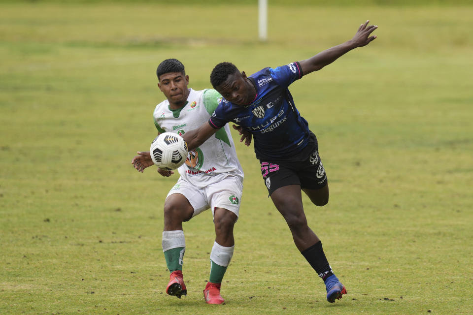 WAITING ON OTHER NAME - Gipson Preciado of Independiente del Valle's under-17 youth soccer team, right, fights for the ball during a match against Mushuc Runa in Tisaleo, Ecuador, Saturday, Sept.3, 2022. The club trains young men in soccer while providing them with up to a high school graduation and has become a key source for the country’s national soccer team. (AP Photo/Dolores Ochoa)