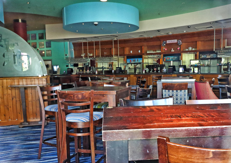 LONDON, UNITED KINGDOM - 2020/05/23: An interior view of a currently closed Wetherspoons pub during the coronavirus crisis. The JD Wetherspoon pub chain unveiled a blueprint to re-open 875 of their pubs. The company will invest £11 million to ensure safety from Covid-19 pandemic with social distancing measures, hand sanitiser dispensers placed around the pub and perspex screens between tables. Staff will wear masks and protective eyewear and will have daily health checks. This is all subject to the Government giving the go ahead for Pubs and restaurants to re-open - possible in the early July. (Photo by Keith Mayhew/SOPA Images/LightRocket via Getty Images)