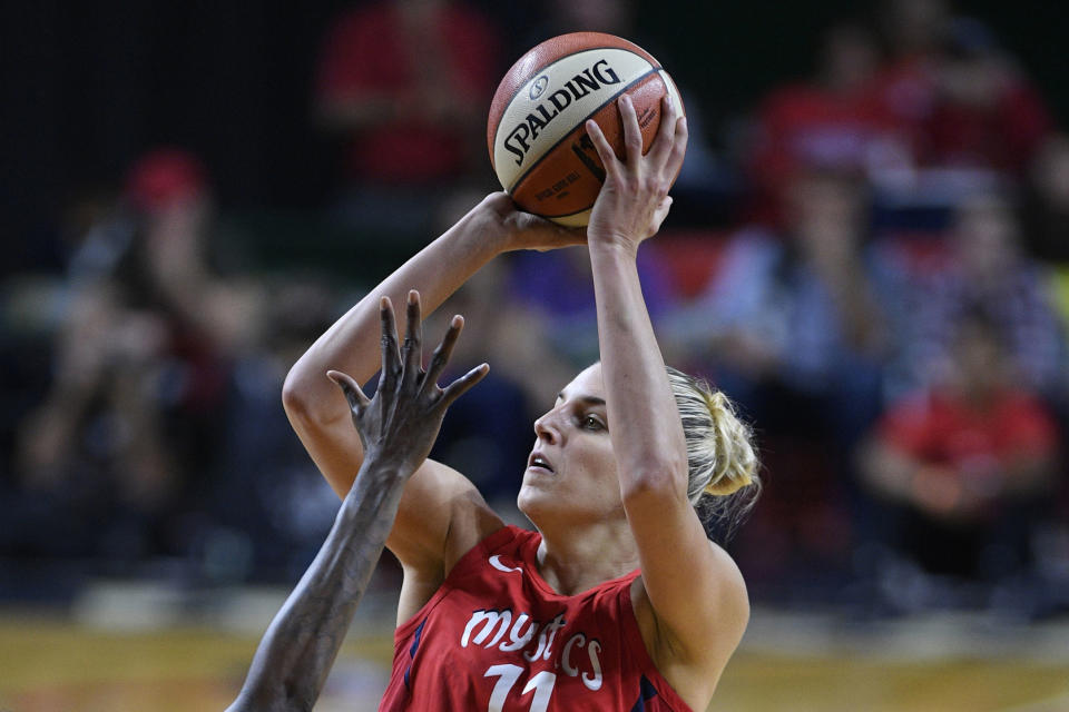 FILE - In this Sept. 12, 2018, file photo, Washington Mystics forward Elena Delle Donne (11) shoots against the Seattle Storm during the second half of Game 3 of the WNBA basketball finals, in Fairfax, Va. Delle Donne was named the Associated Press WNBA OPlayer of the Year, Wednesday, Sept. 11, 2019. (AP Photo/Nick Wass, File)