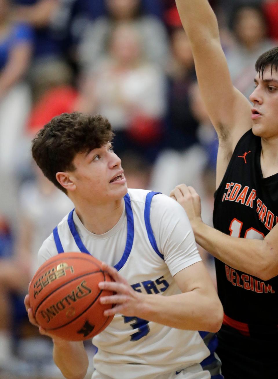 Kohler’s Trey Keller (3) eyes a pass by a Cedar Grove-Belgium player, Thursday, January 12, 2023, in Kohler, Wis.