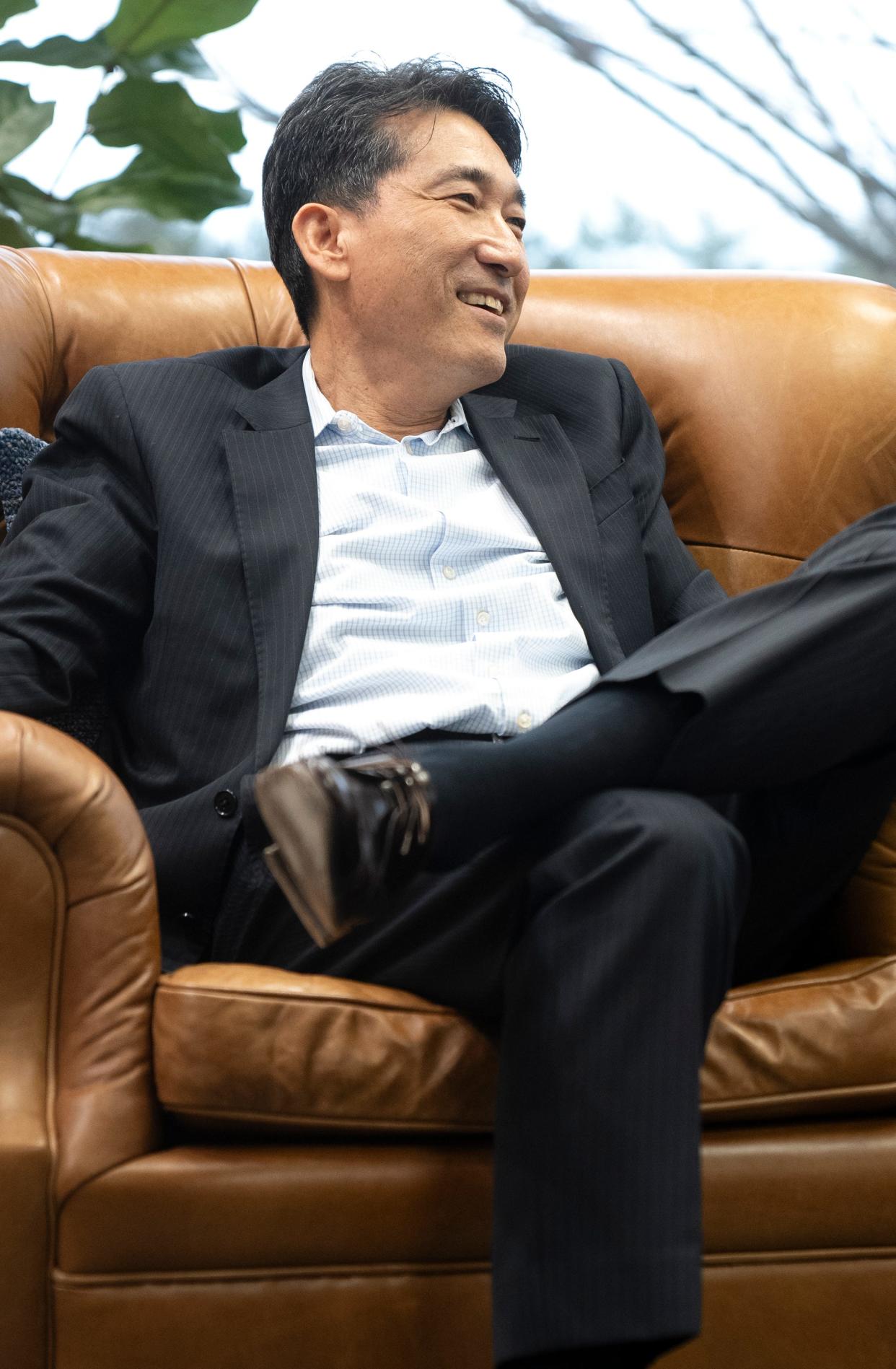 Charley Shin, founder and CEO of Charleys Cheesesteaks, laughs during an interview at the Gosh Enterprises headquarters in Upper Arlington.