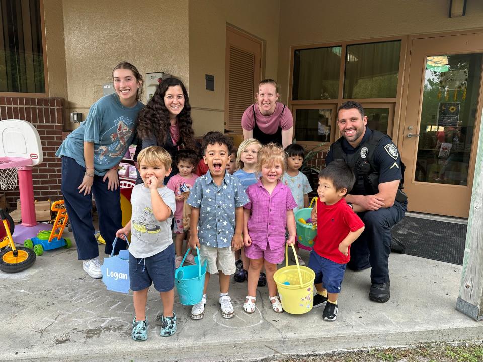 UCF police officers surprised children at the UCF Creative School with an egg hunt.