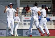 England's James Anderson (2nd R) celebrates taking the wicket of Azhar Ali (not pictured) with Ben Stokes (L). Action Images via Reuters / Jason O'Brien Livepic