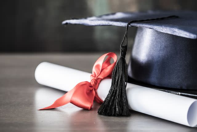 seb_ra / Getty Images A stock image of a graduation hat and a diploma.