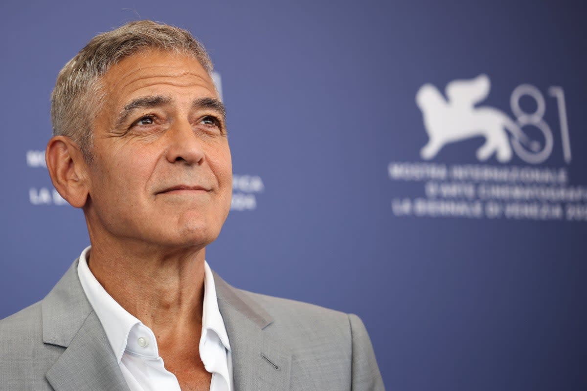 George Clooney poses during a photocall for the movie ‘Wolfs.’ He has praised Biden’s ‘selfless act’ of dropping out of race (REUTERS)