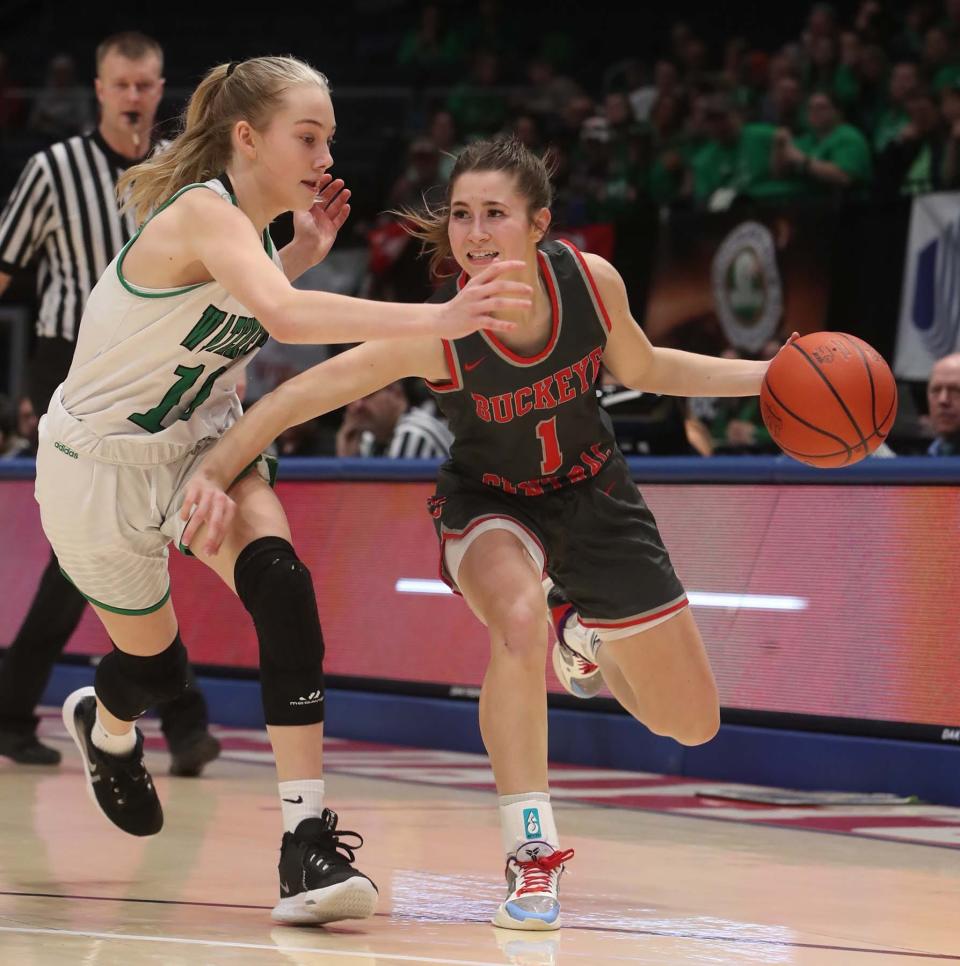 Emily Siesel, right, of Buckeye Central gets ball past Kendall Sury of Waterford during the third period of their Division IV State Semifinal game at University of Dayton Arena Friday in Dayton. Waterford won 53-39.