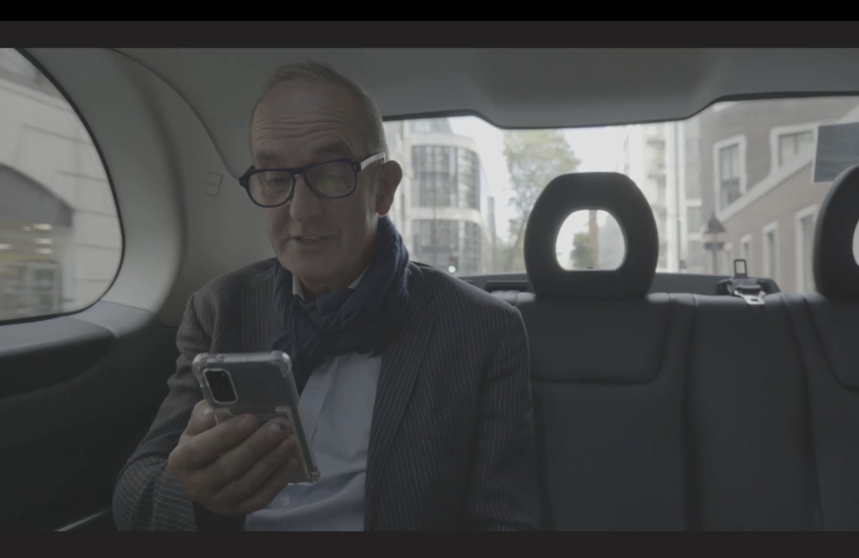 Kevin McCloud reads the message from the organiser on his phone (Channel 4 screengrab)