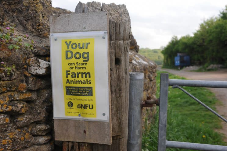 A sign on the farm warning of danger [SWNS]