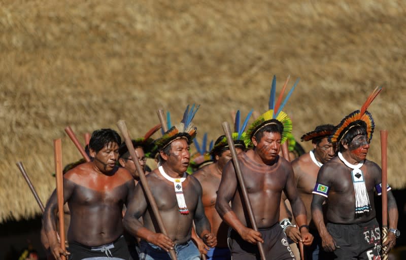 Indigenous men perform during a four-day pow wow in Piaracu village, in Xingu Indigenous Park, near Sao Jose do Xingu, Mato Grosso state