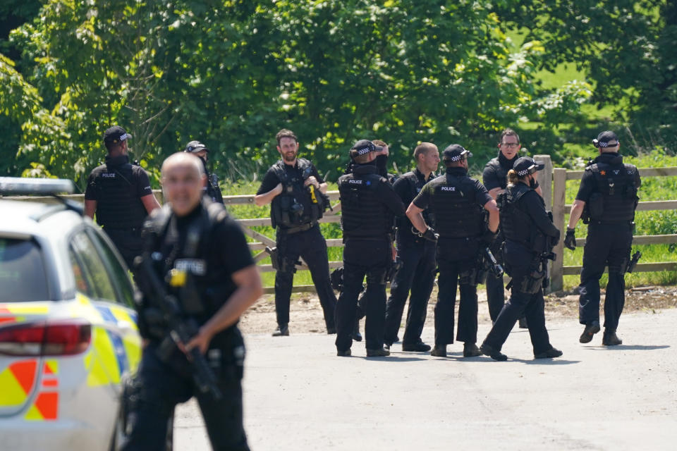 Armed police at Hallington House Farm on the outskirts of Louth, Lincolnshire, after a man was detained by officers hunting for Daniel Boulton, who is sought in connection with the deaths of a 26-year-old woman and her nine-year-old son on Monday. Picture date: Tuesday June 1, 2021.