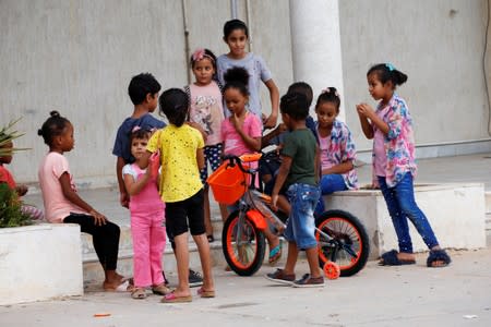 Displaced children, who left their home after clashes, are seen at a school used as a shelter in Tajura neighbourhood, east of Tripoli