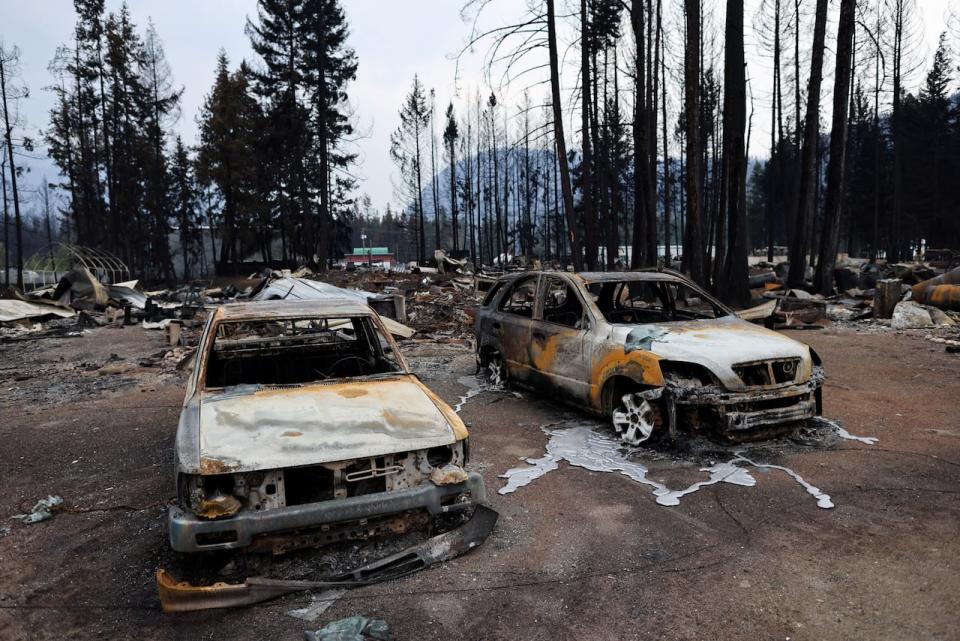 Burned vehicles are pictured after the Bush Creek East wildfire destroyed dozens of homes in multiple rural communities including Scotch Creek, Lee Creek and Celista in the North Shuswap Lake region of B.C. Aug. 23, 2023.