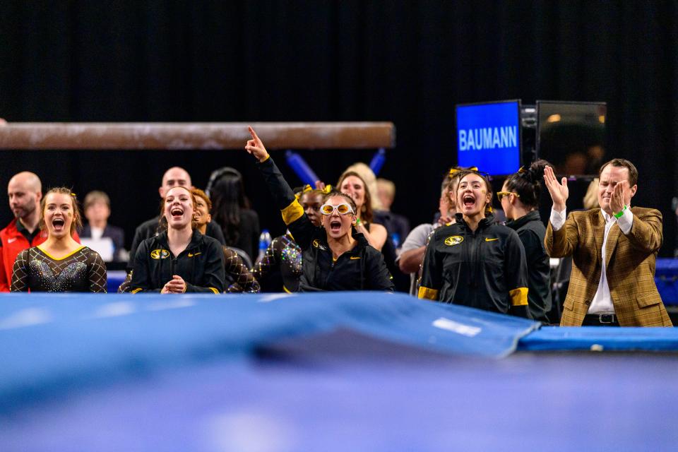 The Missouri gymnastics team cheers for gymnast Alisa Sheremeta on Thursday in the NCAA semifinals.