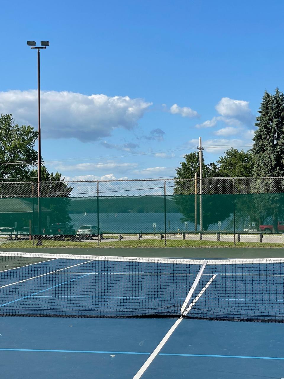 At Bayside Park, tennis courts have permanent pickleball lines, and a view.