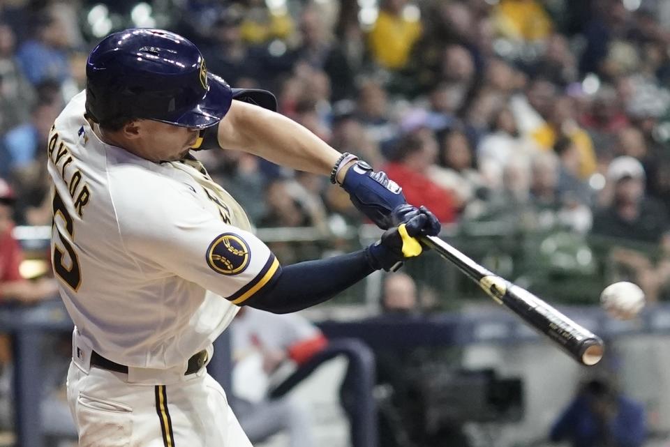 Milwaukee Brewers' Tyrone Taylor hits an RBI double during the seventh inning of a baseball game against the St. Louis Cardinals Wednesday, Sept. 27, 2023, in Milwaukee. (AP Photo/Morry Gash)
