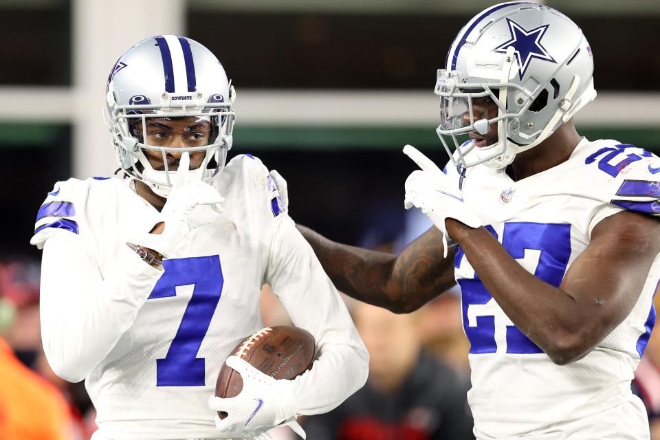 Trevon Diggs #7 of the Dallas Cowboys celebrates with Jayron Kearse #27 after intercepting a pass and returning it for a touchdown in the fourth quarter against the New England Patriots at Gillette Stadium on October 17, 2021 in Foxborough, Massachusetts.