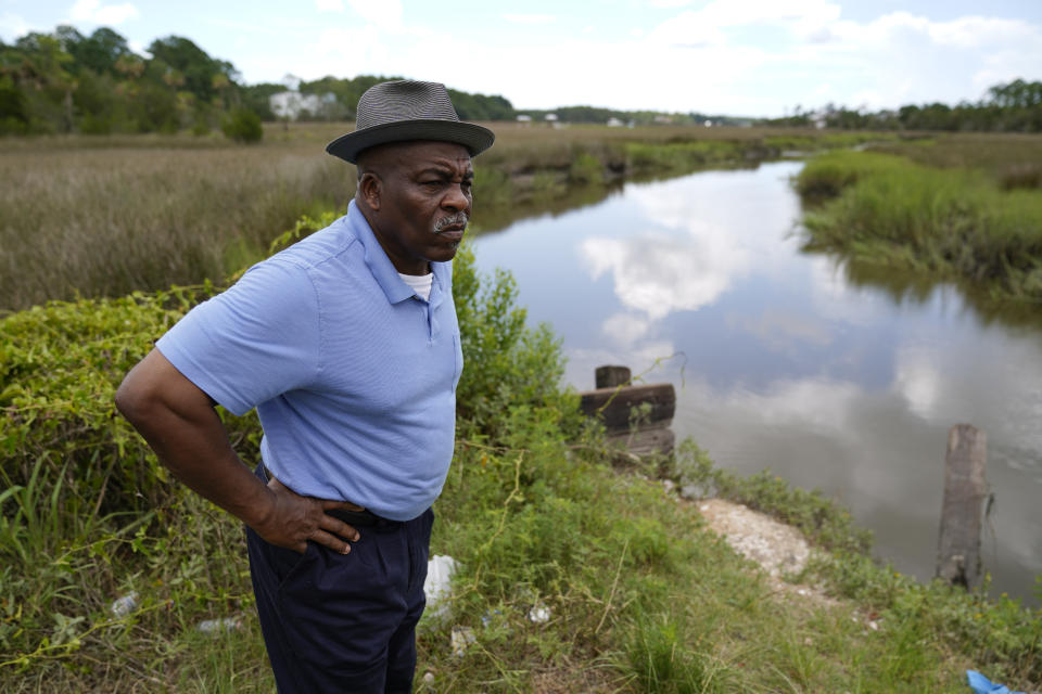 Jonathan Ford, gives a tour of his neighborhood Thursday, July 27, 2023, in Phillips Community, an unincorporated area near Mount Pleasant, S.C. (AP Photo/Erik Verduzco)