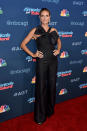 <p>Heidi oozed model style in this simple black jumpsuit, jazzed up with an enlarged bow. <i>[Photo: Getty]</i></p>