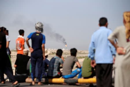 Protesters gather outside the west Qurna 2 oilfield, during a protest in north Basra, Iraq July 14, 2018. Picture taken July 14, 2018. REUTERS/Essam al-Sudani