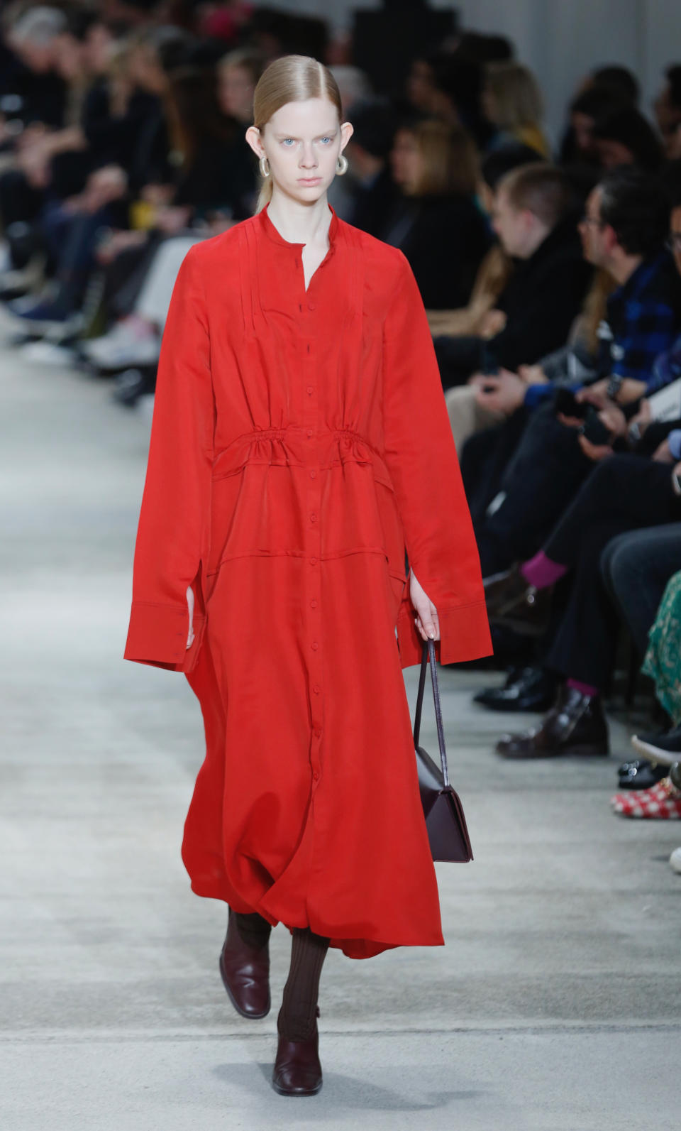 The Jil Sander women's Fall/Winter 2020/2021 collection is unveiled during the Fashion Week in Milan, Italy, Wednesday, Feb. 19, 2020. (AP Photo/Domenico Stinellis)