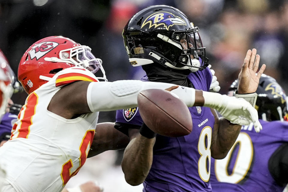 Kansas City Chiefs defensive end Charles Omenihu (90) hits Baltimore Ravens quarterback Lamar Jackson (8) causing a fumble during the first half of an AFC Championship NFL football game, Sunday, Jan. 28, 2024, in Baltimore. (AP Photo/Alex Brandon)