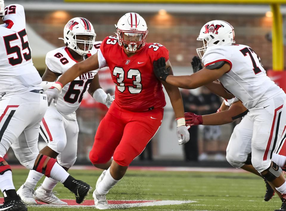 Fairfield defensive lineman James Thomas (33) rushes the quarterback during the Skyline Chili Crosstown Showdown against Wayne at Fairfield Stadium Thursday, Aug. 18, 2022.