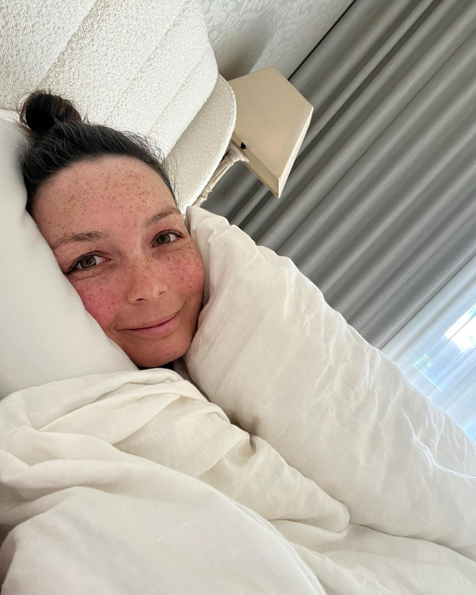 Ricki-Lee Coulter recovering in bed.