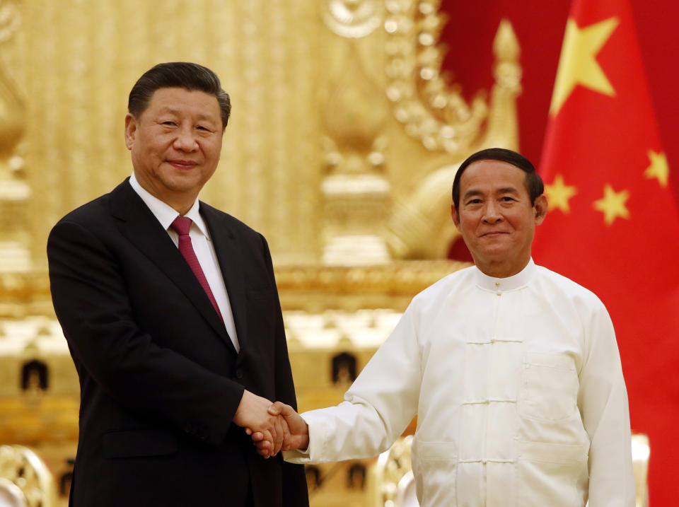 FILE - In this Jan. 17, 2020, file photo, Myanmar's President Win Myint, right, shakes hands with Chinese President Xi Jinping during their meeting at the Presidential Palace in Naypyitaw, Myanmar. Xi deepened relations with Myanmar during a state visit last week to a neighbor who has been among the most supportive in Beijing’s dispute with other members of the Association of Southeast Asian Nations over the South China Sea. (AP Photo/Aung Shine Oo, File)
