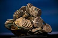 A block of encrusted silver coins from the shipwreck of a 1804 galleon, on its first display to the media at a Ministry building, in Madrid, Friday, Nov. 30, 2012. Spanish cultural officials have allowed the first peep at 16 tons (14.5 metric tons) of the shipwreck, 'Nuestra Senora de las Mercedes' a treasure worth an estimated $500 million that a U.S. salvage company gave up after a five-year international ownership dispute. (AP Photo/Daniel Ochoa de Olza)