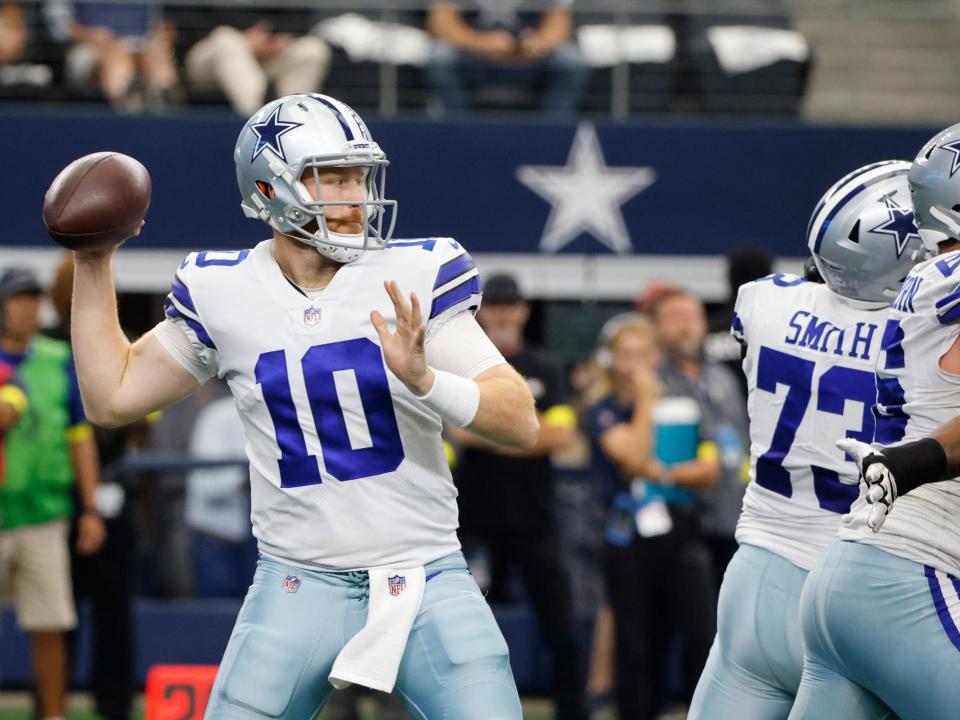 Cooper Rush looks to pass against the Washington Commanders.