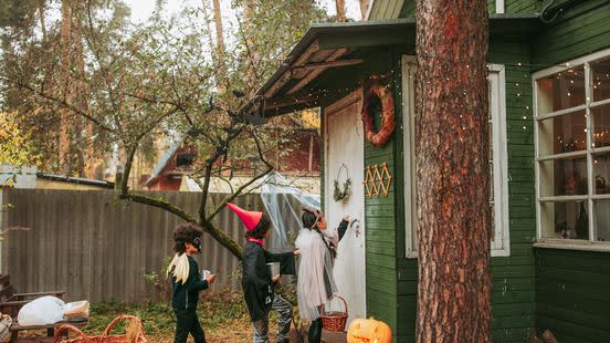 group of children trick or treating during halloween