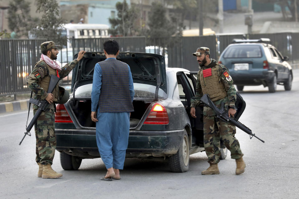 In this Tuesday, Sept. 24, 2019 photo, Afghan National Army soldiers search a car at a checkpoint ahead of presidential elections scheduled for Sept. 28, in Kabul, Afghanistan. Afghans facing down Taliban threats are torn between fear, frustration and sense of duty as they decide whether to go to the polls Saturday to choose a new president. But the security preparations have been elaborate. (AP Photo/Ebrahim Noroozi)