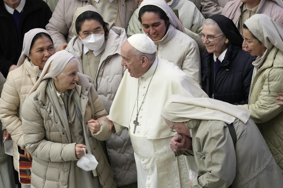 Pope Francis greets a group of nuns during his weekly general audience at the Vatican, Wednesday, Jan. 19, 2022. (AP Photo/Andrew Medichini)