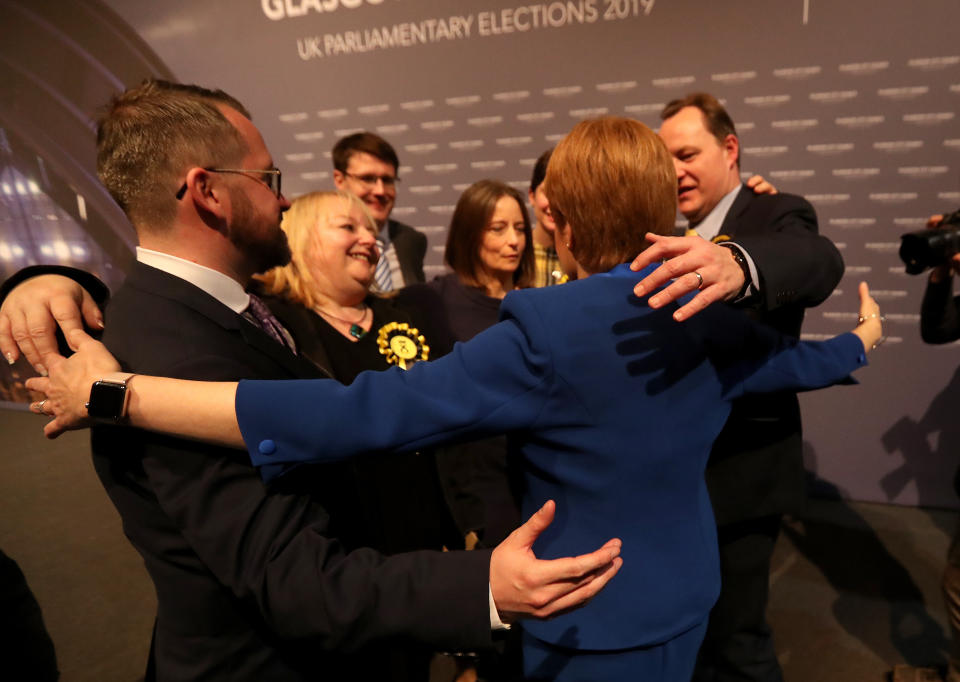 First Minister Nicola Sturgeon hugs her newly elected MPs at the SEC Centre in Glasgow after counting for the 2019 General Election. (Photo by Andrew Milligan/PA Images via Getty Images)