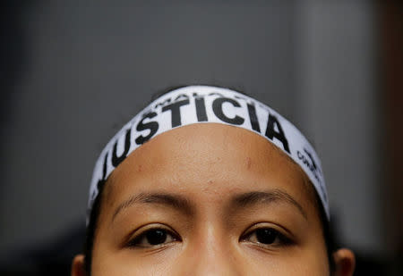 A woman wears a headband reading "Justice" during an anti-government protest outside Guatemala's Congress in Guatemala City, Guatemala September 15, 2017. REUTERS/Luis Echeverria