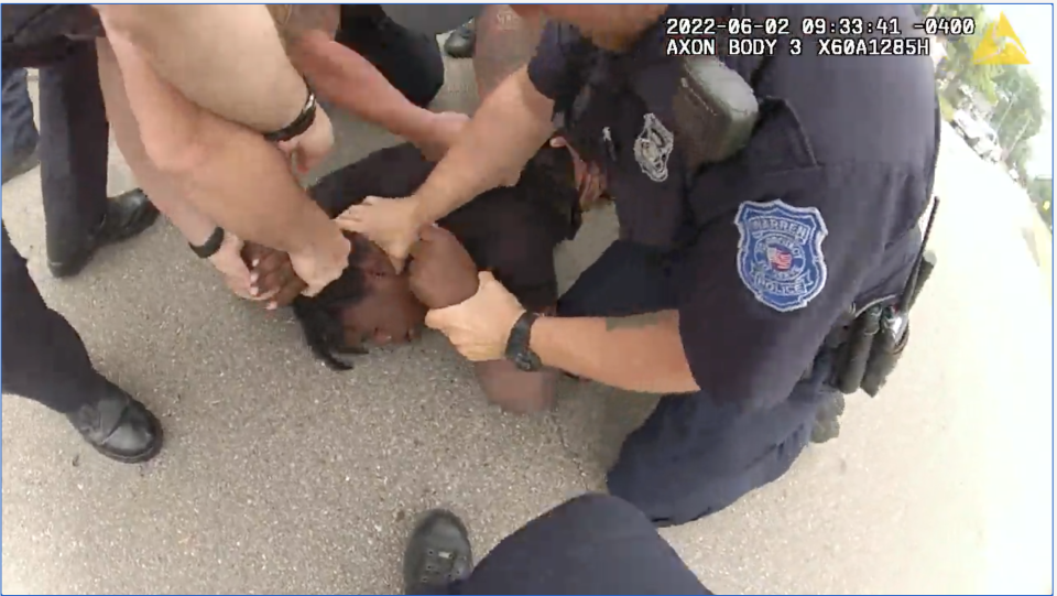 A framegrab from Warren Police officer body cam of Tyler Wade being pushed to the ground, choked and punched during an arrest in Ferndale in June